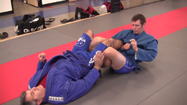 Coach Vladislav Koulikov demonstrating a leg lock on Coach Tom Frale.